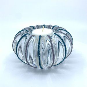 Small round glass tea candle holder, 13 1/2 in. circum. 5 1/2 in. W, H 2 in.